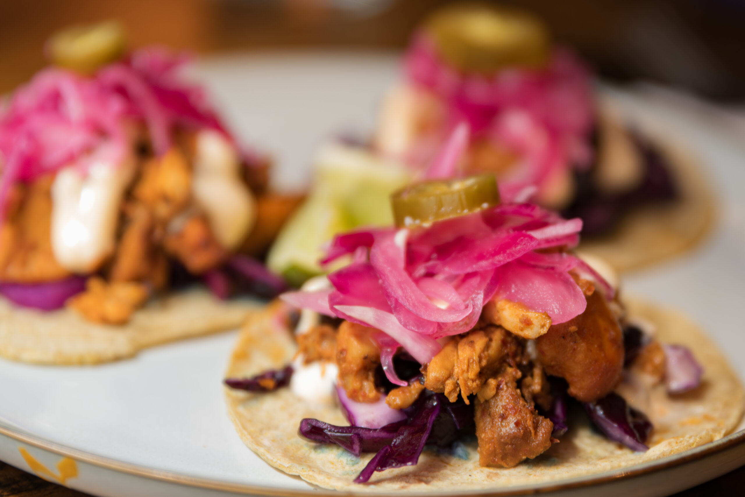 CU4TRO tacos with pickled onion